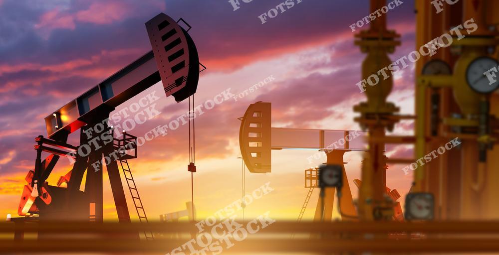 Силуэты нефтяных качалок работают на фоне красочного заката. Изображение символизирует процесс добычи нефти и подчеркивает роль природных ресурсов в энергетической отрасли.